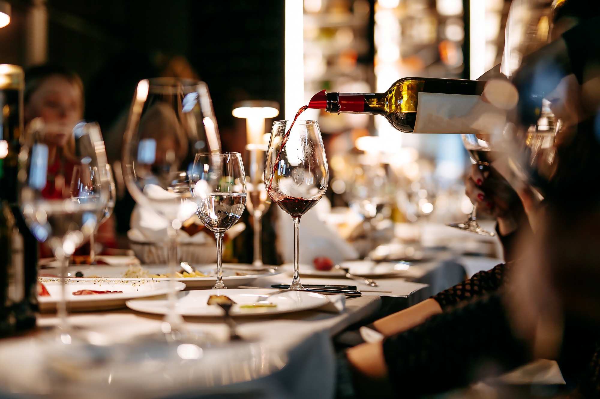 Close up of wine tasting at restaurant during evening time